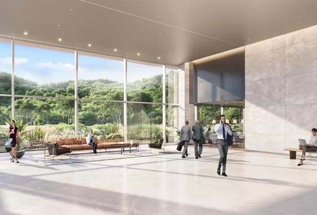 The formal lobby features 18-foot limestone and glass walls, connecting to a casual riverfront café space. 
